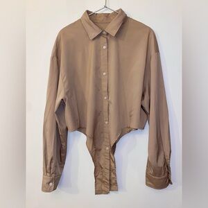 Tan button down shirt with pseudo-bodysuit detail
